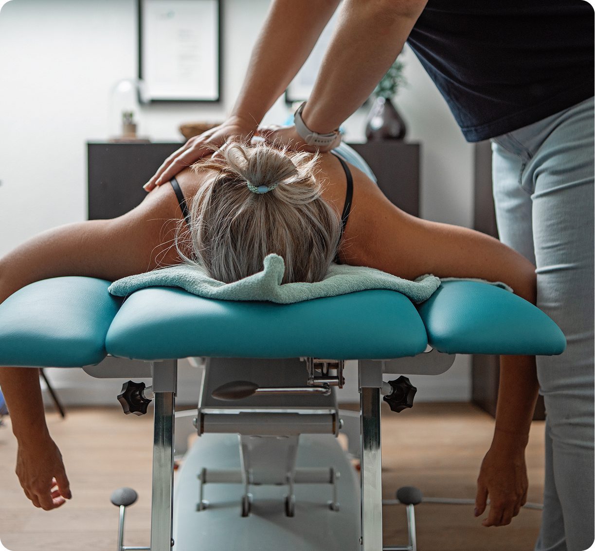 Woman receiving back massage on table
